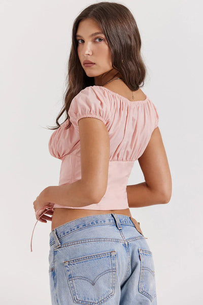 Isa - Top rosa bebé con volantes